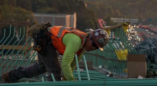 Construction worker installing rebar on a jobsite