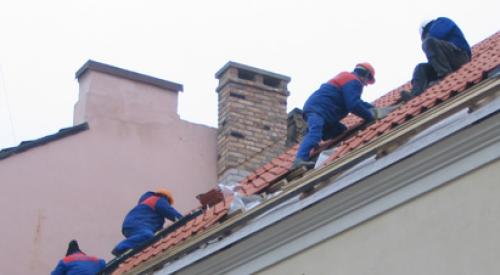 construction workers on roof at danger of falls and injury