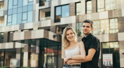 Couple in front of apartment