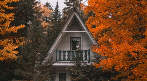 A-Frame home in the woods with colorful trees