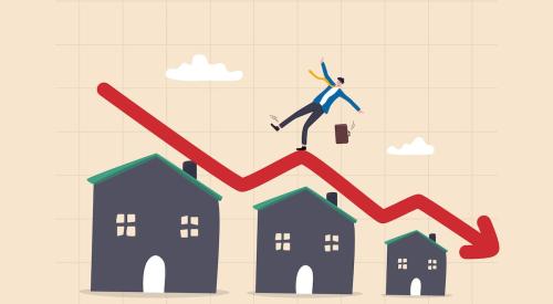 Businessman standing on falling red arrow above levels of homes