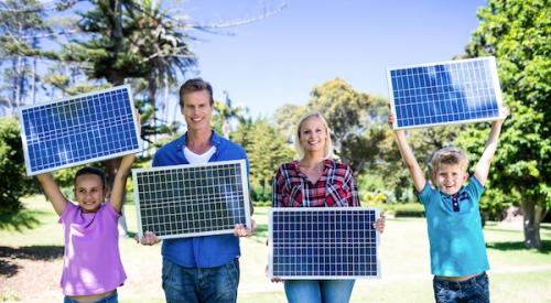 Family Holding Solar Panels