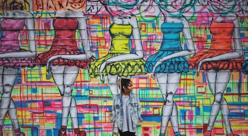 Woman standing in front of wall, Houston, Texas