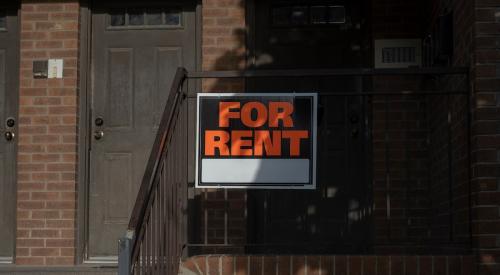 Orange and black for rent sign outside of house