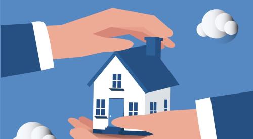 Hands holding house against blue background