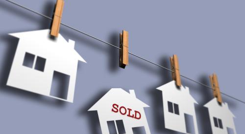 Home sold falling from clothesline holding white houses