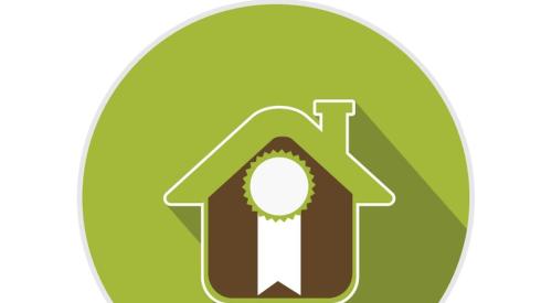 Green circle around house with award ribbon