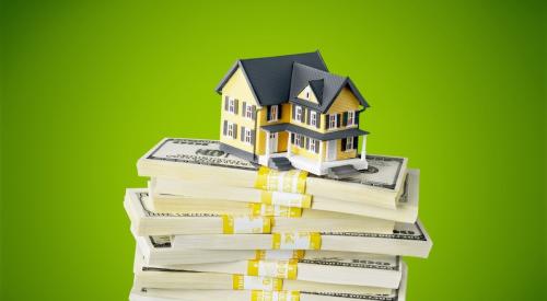 House on top of stacks of cash with green background