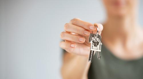 Person holding silver house keys
