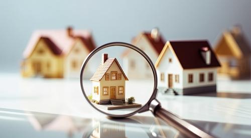 Magnifying glass over house