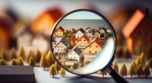 Houses against magnifying glass