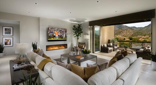 The living room at infill housing project Icon at Silverleaf has expansive desert views