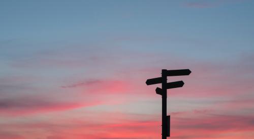 Signposts shadowed at sunset