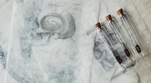 Renderings of skulls with test tubes that say "BOO"