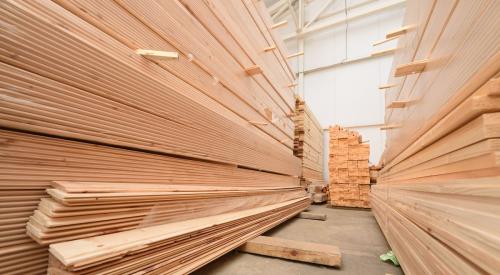 Lumber boards stacked in warehouse