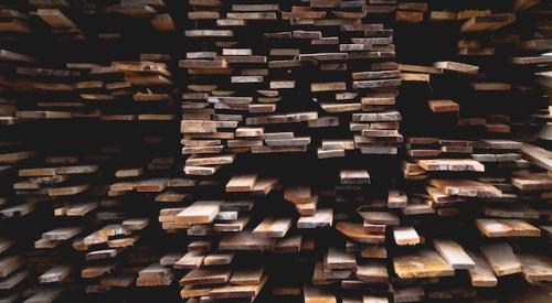 Planks_of_wood_stacked_in_shelves
