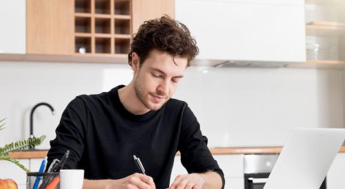 Man filling out Paycheck Protection Program (PPP) loan application