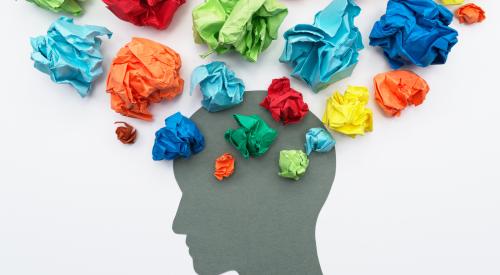 Mental health, silhouette of head with crumbled colored paper