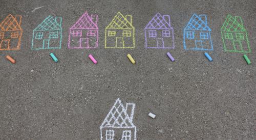 Houses drawn in chalk on sidewalk