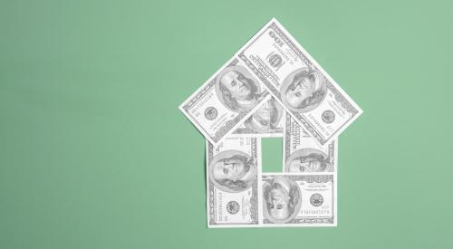 One hundred dollar bills in the shape of a house with green background