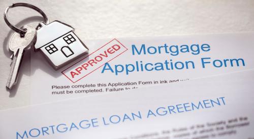 Red approval stamp on mortgage application form