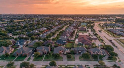 Aerial view of residential neighborhood at sunset