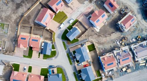 Aerial view of new houses under construction in residential neighborhood