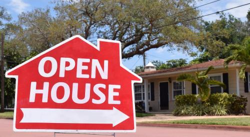 Red open house sign pointing toward home