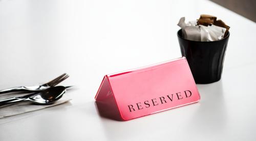 Reserved label on a dining table