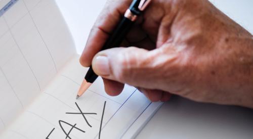 Hand writing 'tax'