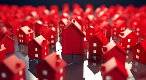Cluster of red single-family model homes