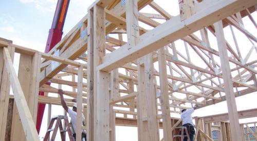 construction workers framing house during labor shortage