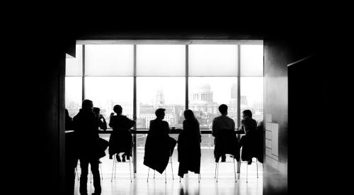 Boardroom with people in it black and white