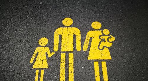 Painted pedestrian sign of family