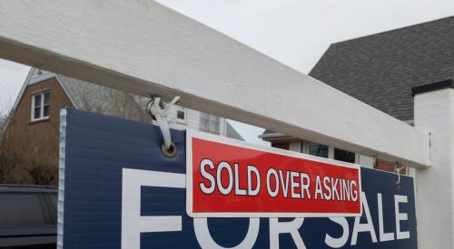 Home sold over asking sign