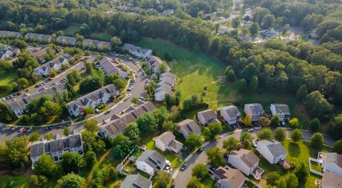 Aerial view of suburban homes where square footage is worth more 