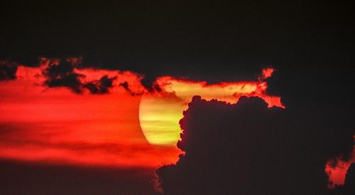 Sunset behind a cloud