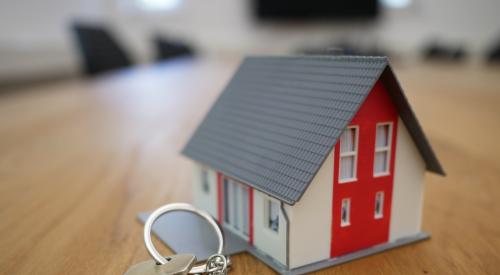 Model house and keys for new homeowners 