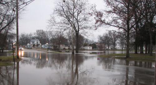 Floodwaters rising in residential neighborhood