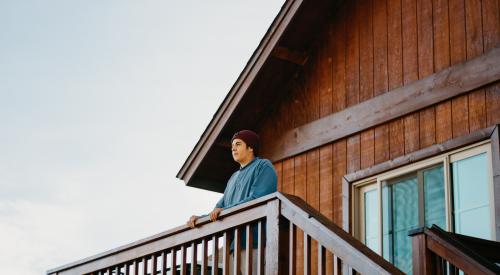 Man standing on balcony