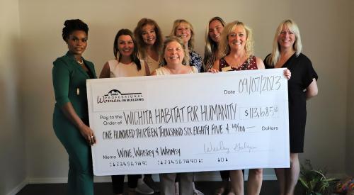 Wichita Professional Women in Building Council presenting a fundraising check 