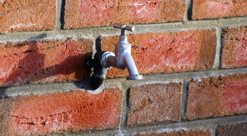 Spigot on a brick wall | mortgage application volume fell as interest rates ticked up, showing timid economic sentiment