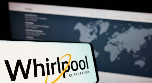 Whirlpool logo on phone next to map on computer