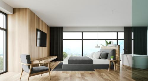 Hardwood flooring in primary bedroom