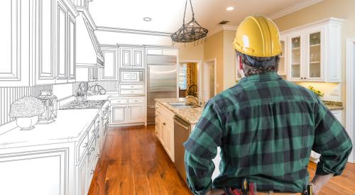 Home builder looking at actual and virtual kitchen