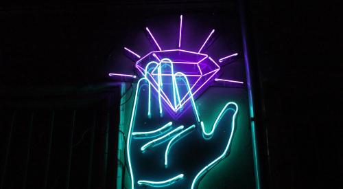 Neon sign of hand and diamond